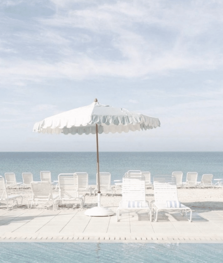 beach chairs and scalloped umbrellas